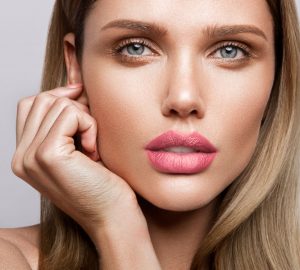 Beautiful,Young,Model,With,Pink,Lips,And,Nude,Manicure
